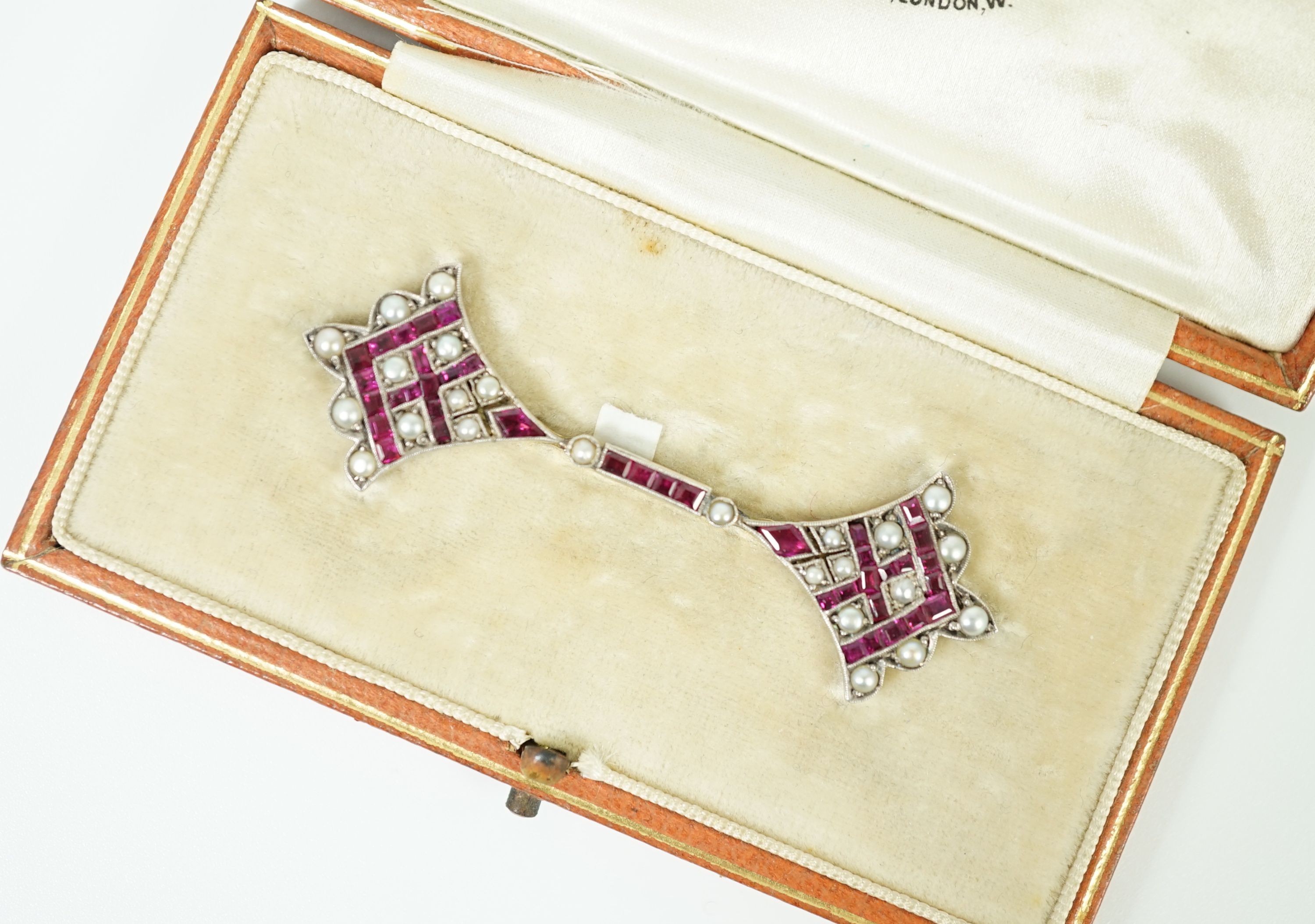 An early 20th century, gold, platinum, ruby and seed pearl set brooch